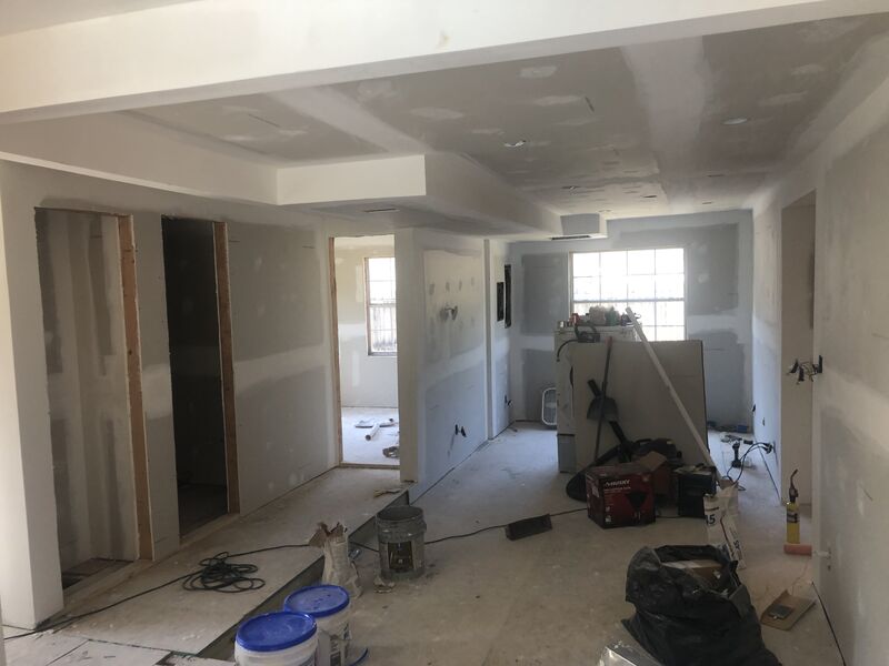 Home stripped back during a whole-home renovation, framing and services exposed