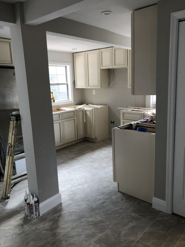 Interior under construction with new drywall and openings framed