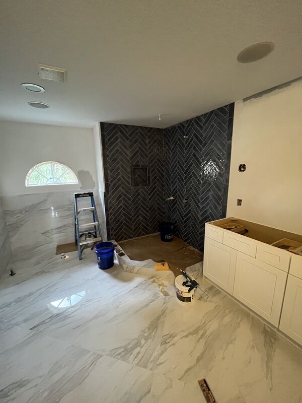Walk-in tile shower in a completed bathroom